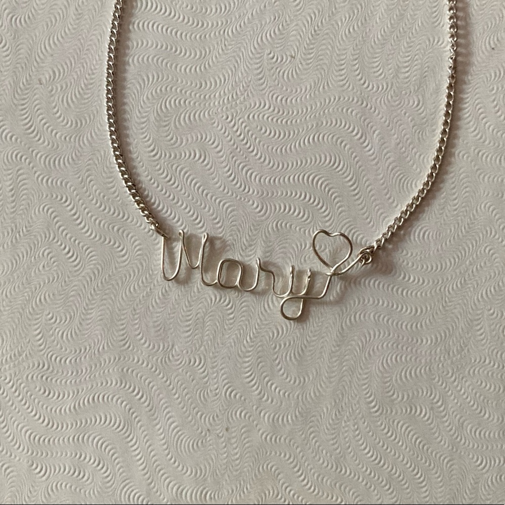 “Mary” necklace.